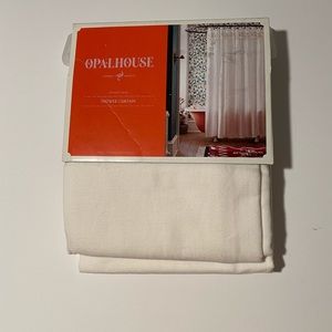 Beautiful cream shower curtain.